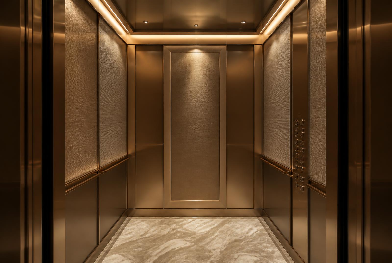Premium maatwerk liftcabine in champagne brons met indirecte verlichting